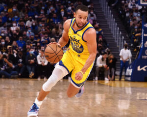 Golden State Warriors guard Stephen Curry drives toward the basket against the Sacramento Kings