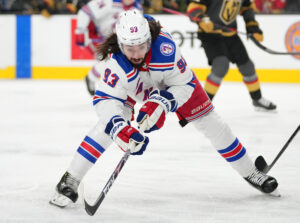 New York Rangers center Mika Zibanejad reaches for the puck during a game against the Vegas Golden Knights