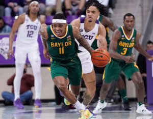 Baylor Bears guard James Akinjo dribbles the ball up court against the TCU Horned Frogs during a Big 12 basketball game