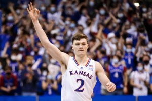 Kansas Jayhawks guard Christian Braun celebrates after making a 3-point basketball against the Iowa State Cyclones during a Big 12 basketball game