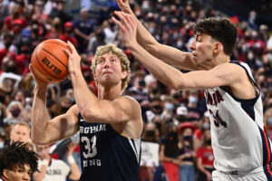 Saturday College Basketball Odds - Jan 13, 2022; Spokane, Washington, USA; Brigham Young Cougars forward Caleb Lohner (33) shoots the ball against Gonzaga Bulldogs center Chet Holmgren (34) in the second half at McCarthey Athletic Center. Gonzaga won 110-84.