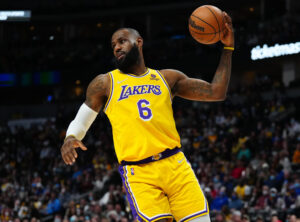 Los Angeles Lakers forward LeBron James grabs a rebound in the first quarter against the Denver Nuggets