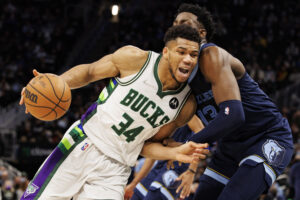 Milwaukee Bucks forward Giannis Antetokounmpo (left) drives tp the basket against Memphis Grizzlies forward Jaren Jackson Jr. (right)