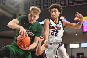 San Francisco Dons forward Zane Meeks (left) grabs a rebound against Gonzaga Bulldogs forward Anton Watson (right) during a West Coast Conference basketball game