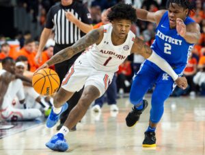 Auburn Tigers guard Wendell Green Jr. (left) drives the ball against an Kentucky guard Sahvir Wheeler during an SEC basketball game