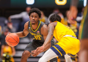 Baylor Bears guard Adam Flagler dribbles the ball against the West Virginia Mountaineers