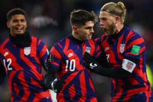 United States forward Christian Pulisic, middle, and defenseman Walker Zimmerman, right, celebrate after Pulisic scored a goal against Honduras during a CONCACAF FIFA World Cup Qualifier soccer match at Allianz Field on Feb. 2, 2022.