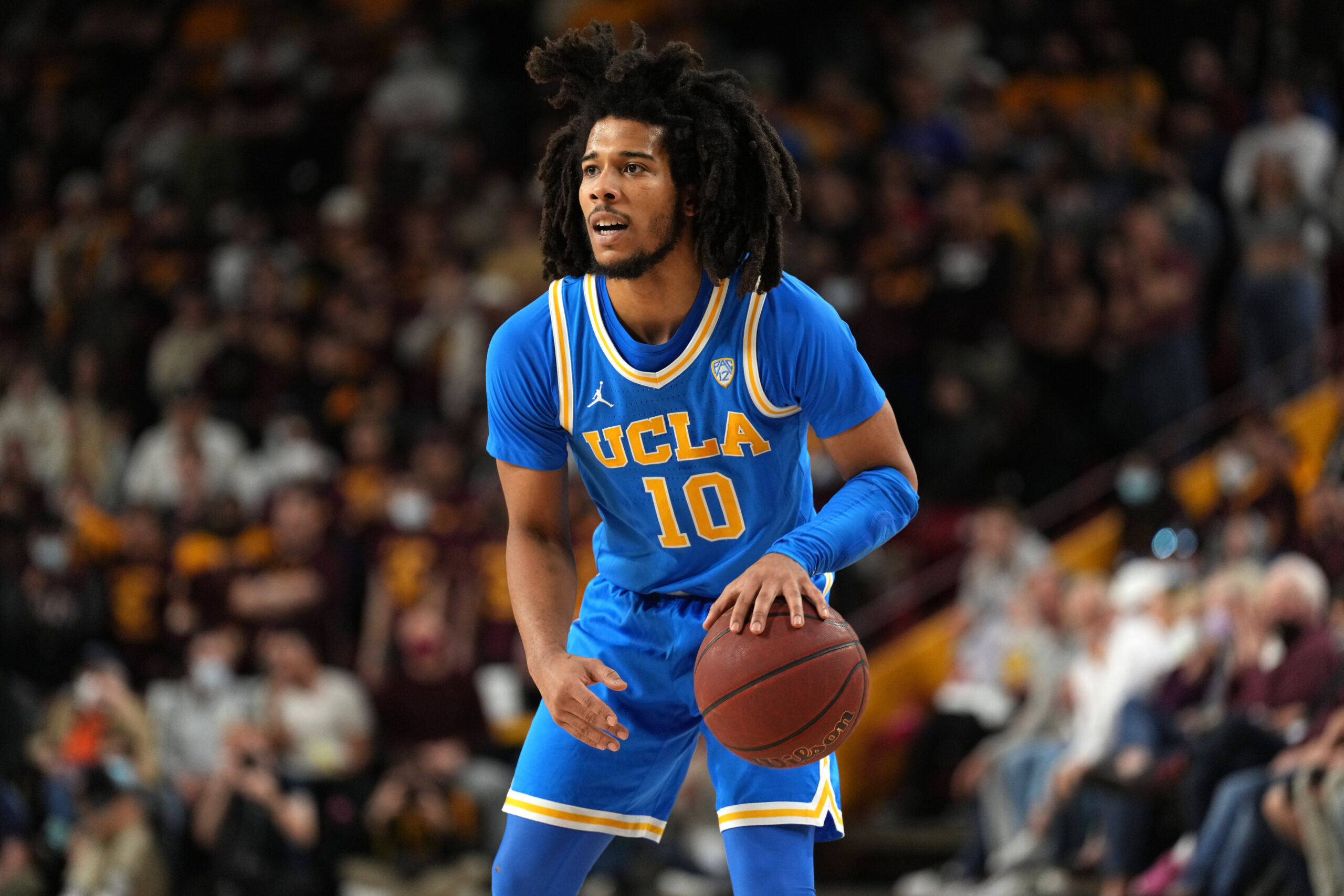 UCLA Bruins guard Tyger Campbell dribbles during a Pac-12 basketball game against the Arizona State Sun Devils