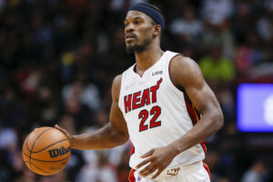 Miami Heat forward Jimmy Butler dribbles the basketball in a game against the Dallas Mavericks