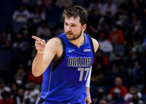 Dallas Mavericks guard Luka Doncic points toward a teammate as he reacts to a play against the New Orleans Pelicans