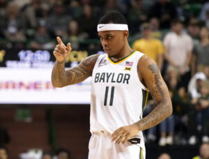 Baylor Bears guard James Akinjo points to the basket after a made free thrown during a Big 12 basketball game against the TCU Horned Frogs