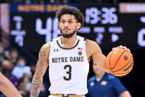 Notre Dame Fighting Irish guard Prentiss Hubb dribbles the basketball with his left hand against the Georgia Tech Yellow Jackets during an ACC game