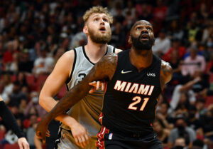 Miami Heat center Dewayne Dedmon (21) and San Antonio Spurs center Jock Landale (34) try to get position for a rebound during the second half at FTX Arena.