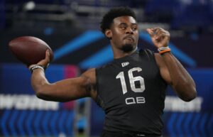 Liberty quarterback Malik Willis (QB16) goes through a drill during the 2022 NFL Scouting Combine at Lucas Oil Stadium.