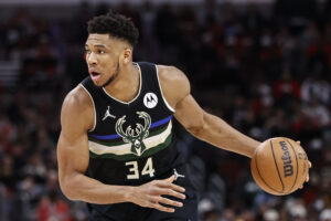 Milwaukee Bucks forward Giannis Antetokounmpo dribbles the ball down the court with his left hand during a game against the Chicago Bulls