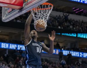 Dallas Mavericks forward Dorian Finney-Smith dunks the basketball with his right hand against the Utah Jazz