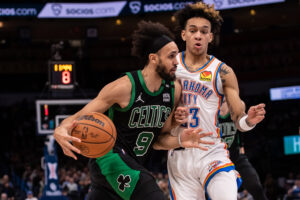 Boston Celtics guard Derrick White (9) moves the ball while defended by Oklahoma City Thunder guard Tre Mann (23) during the second half at Paycom Center. 