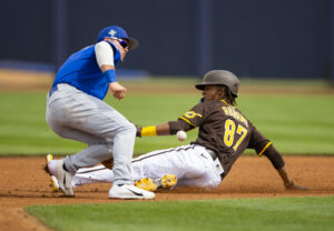 Padres shortstop CJ Abrams (right) steals second base against Chicago Cubs infielder Nico Hoerner (left) 