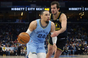 Memphis Grizzlies guard Dillon Brooks (24) drives to the basket as Golden State Warriors forward Nemanja Bjelica (8) defends during the first half at FedExForum. 