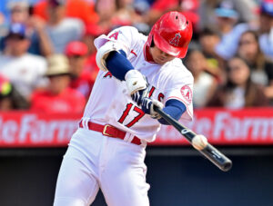 Los Angeles Angels starting pitcher and designated hitter Shohei Ohtani swings his bat left-handed and connects with the baseball during a game against the Houston Astros