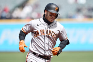 San Francisco Giants second baseman Thairo Estrada smiles as he rounds the bases after hitting a home run against the Cleveland Guardians