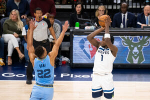 Minnesota Timberwolves forward Anthony Edwards (right) shoots against the Memphis Grizzlies guard Desmond Bane (left) in the second quarter during game four of the first round for the 2022 NBA playoffs at Target Center.