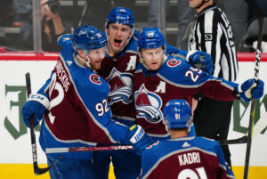 Colorado Avalanche center Nathan MacKinnon (29) celebrates his goal with left wing Gabriel Landeskog (92) and right wing Mikko Rantanen (96) during a Stanley Cup Playoff game against the Nashville Predators