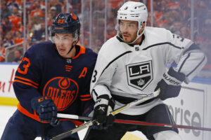 Edmonton Oilers forward Ryan Nugent-Hopkins (left) and Los Angeles Kings defensemen Matt Roy (right) battle for position during a Stanley Cup Playoffs game