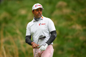 Anirban Lahiri watches his shot from the seventh tee 