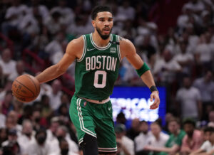 Boston Celtics forward Jayson Tatum (0) dribbles up the court against the Miami Heat during the first half of game one of the 2022 eastern conference finals at FTX Arena.