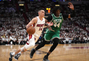 Miami Heat guard Tyler Herro (14) dribbles up the court against Boston Celtics center Robert Williams III (44) during the second half of game one of the 2022 eastern conference finals at FTX Arena.