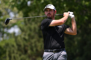 Patrick Cantlay plays his shot from the seventh tee during a practice round for the PGA Championship golf tournament at Southern Hills Country Club.