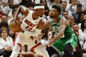 Boston Celtics guard Marcus Smart (right) defends Miami Heat forward Jimmy Butler (left) during the first half of game two of the 2022 eastern conference finals at FTX Arena.