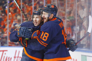 Edmonton Oilers forward Ryan Nugent-Hopkins (left) celebrates his goal against the Calgary Flames with teammate Zach Hyman during Game 4 of the 2022 Stanley Cup Playoffs