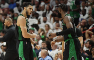 Boston Celtics forward Jayson Tatum, left, celebrates with guard Jaylen Brown, right, during the fourth quarter of game five of the 2022 eastern conference finals against the Miami Heat at FTX Arena on May 25, 2022.