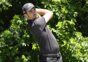 Troy Merritt plays his shot from the sixth tee during the first round of the Charles Schwab Challenge golf tournament.