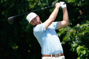 Chris Kirk plays his shot from the sixth tee during the third round of the Charles Schwab Challenge golf tournament.