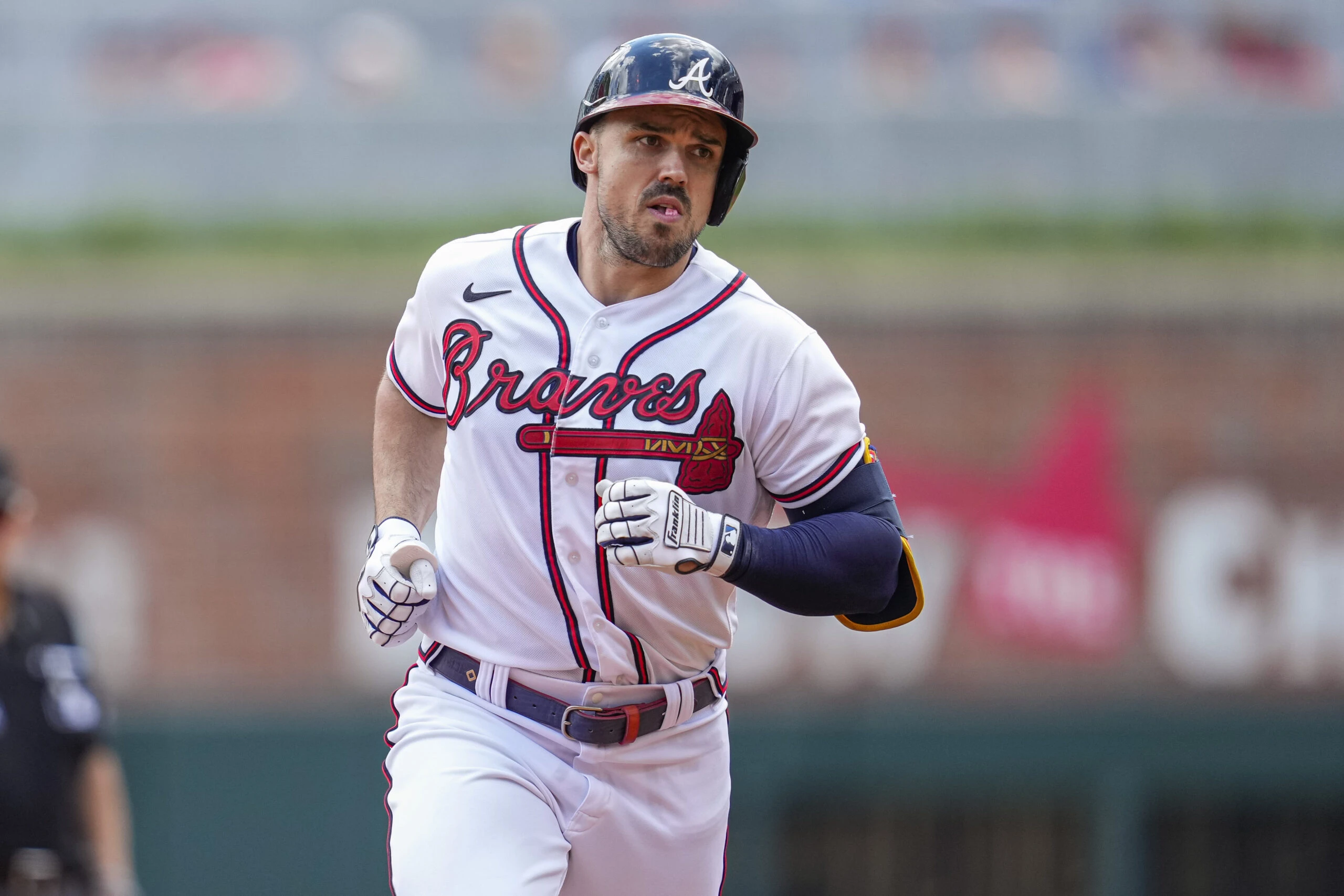 Atlanta Braves left fielder Adam Duvall (14) runs the bases after hitting a home run against the Pittsburgh Pirates during the second inning at Truist Park.