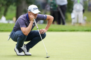 Justin Thomas lines up a putt on the eighth green during the first round of the U.S. Open golf tournament.