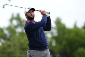 Jon Rahm plays his shot from the sixth tee during the final round of the U.S. Open golf tournament. 