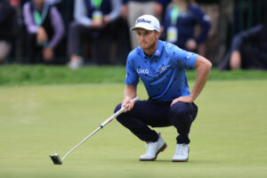 Will Zalatoris lines up a putt on the 18th green during the final round of the U.S. Open golf tournament. 