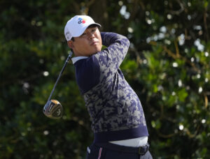 Si-woo Kim hits his tee shot on the 3rd hole