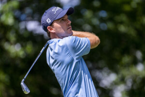 Russell Henley hits his tee shot on the par 3 eleventh hole during the third round of the Rocket Mortgage Classic