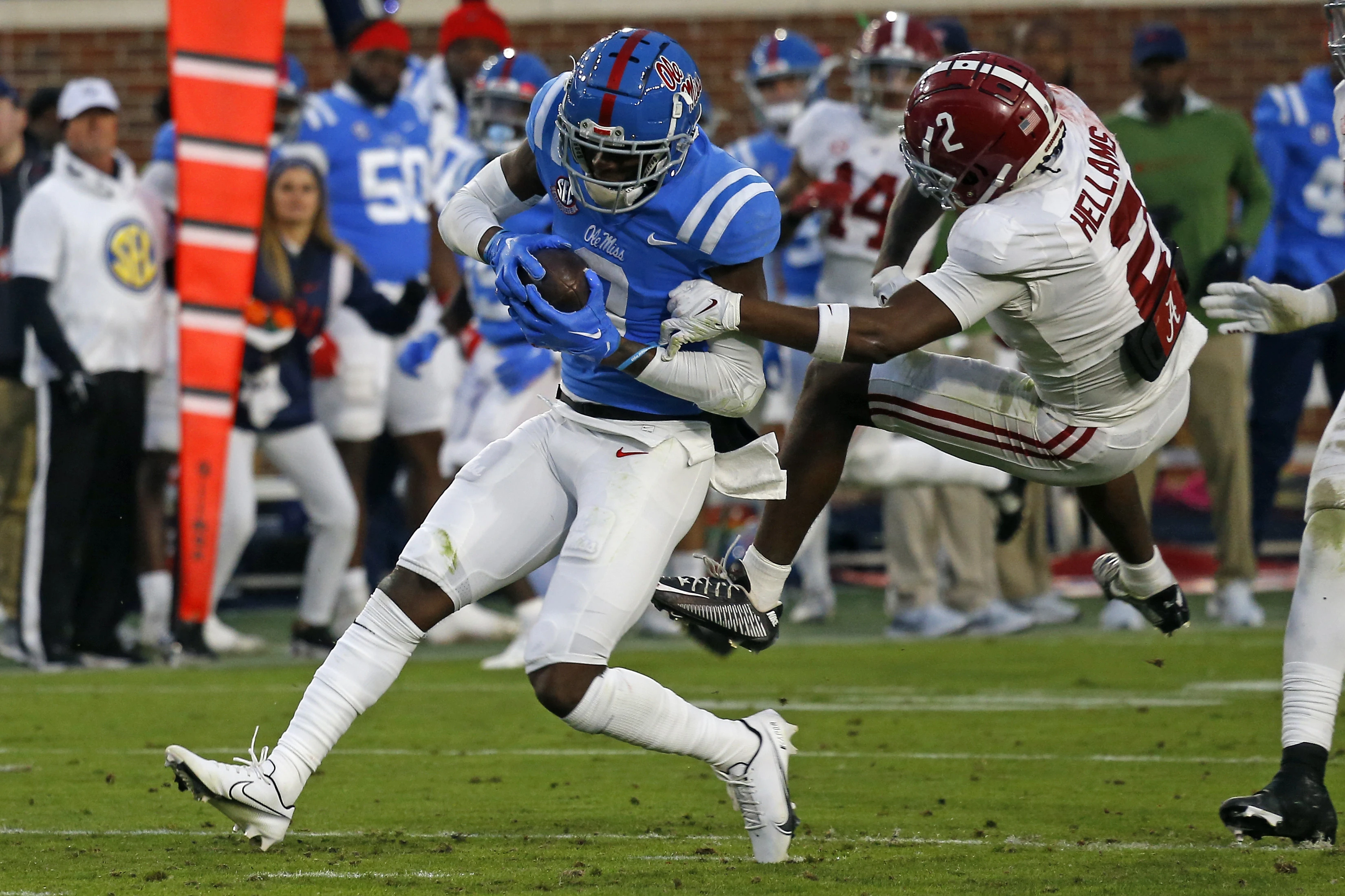 Nov 12, 2022; Oxford, Mississippi, USA; Mississippi Rebels wide receiver Malik Heath (8) runs after a catch as Alabama Crimson Tide running back Jase McClellan (2) attempts to make the tackle during the second half at Vaught-Hemingway Stadium.