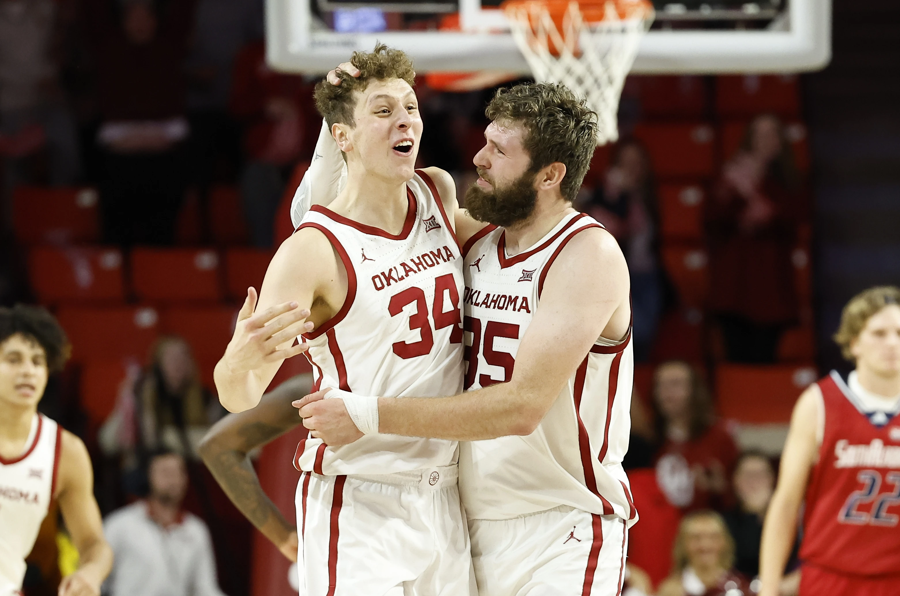 Oklahoma Sooners forward Jacob Groves (34) and forward Tanner Groves (35) celebrate after Jacob blocked a shot by South Alabama during the second half at Lloyd Noble Center. Oklahoma won 64-60.