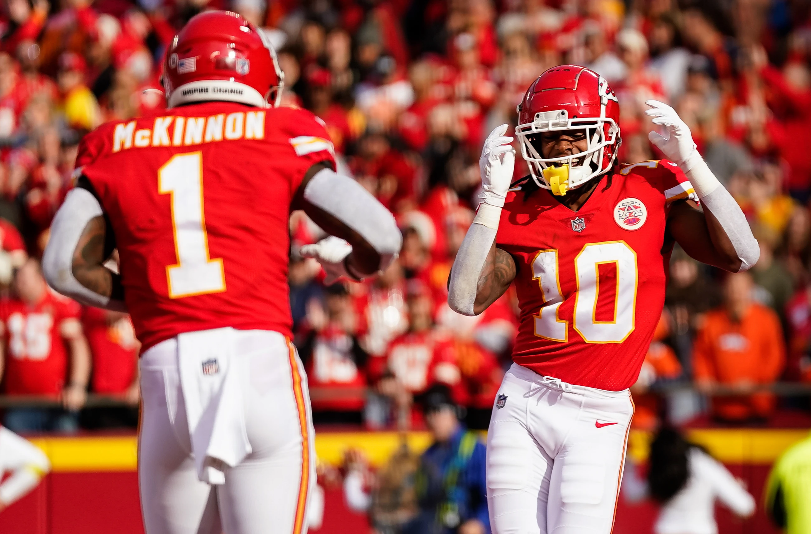 Kansas City Chiefs running back Isiah Pacheco (10) celebrates with running back Jerick McKinnon (1) after scoring a touchdown during the first half against the Denver Broncos at GEHA Field at Arrowhead Stadium.