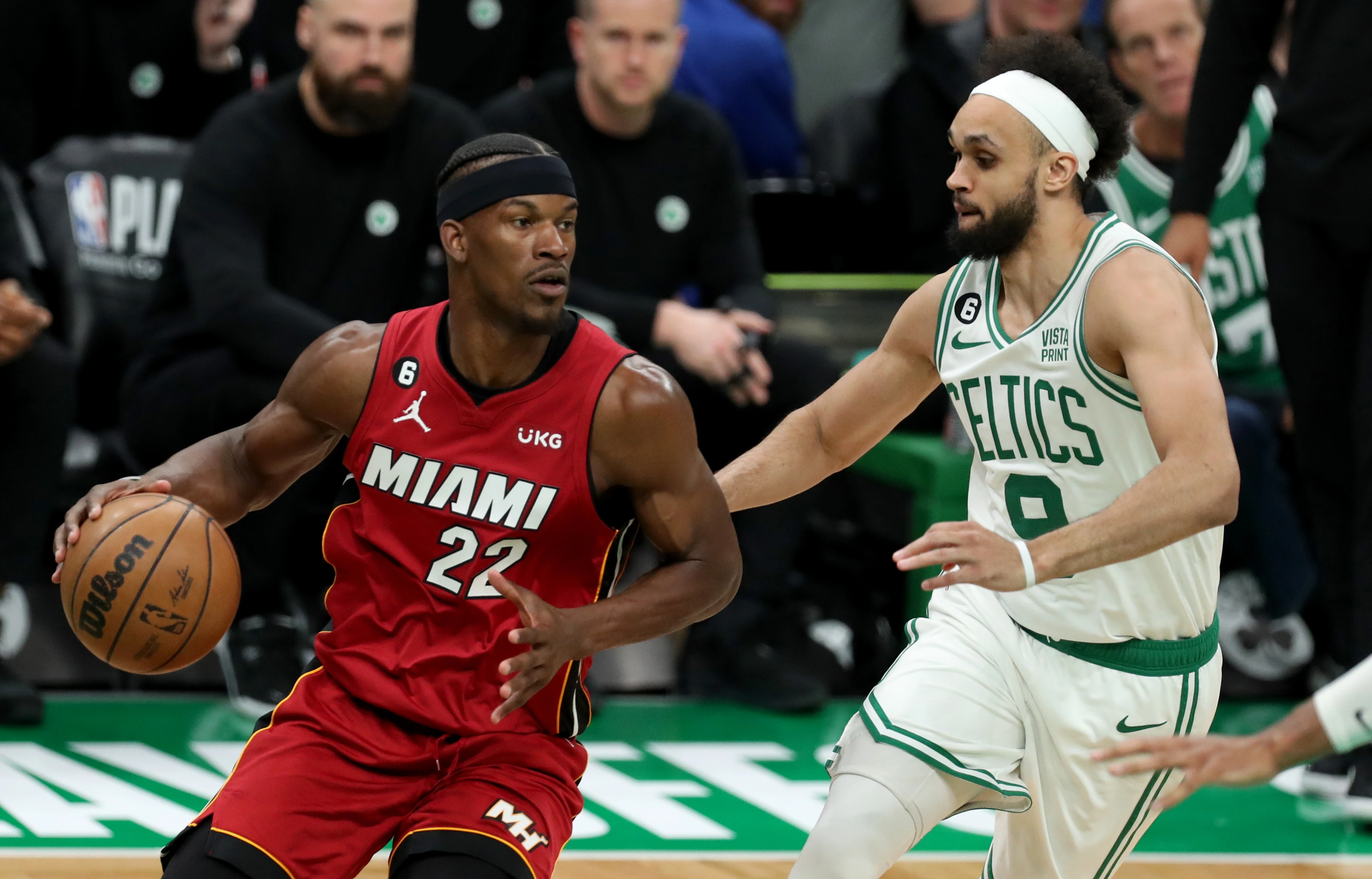 May 17, 2023; Boston, Massachusetts, USA; Miami Heat forward Jimmy Butler (22) dribbles against Boston Celtics guard Derrick White (9) during the second half in game one of the Eastern Conference Finals for the 2023 NBA playoffs at TD Garden.