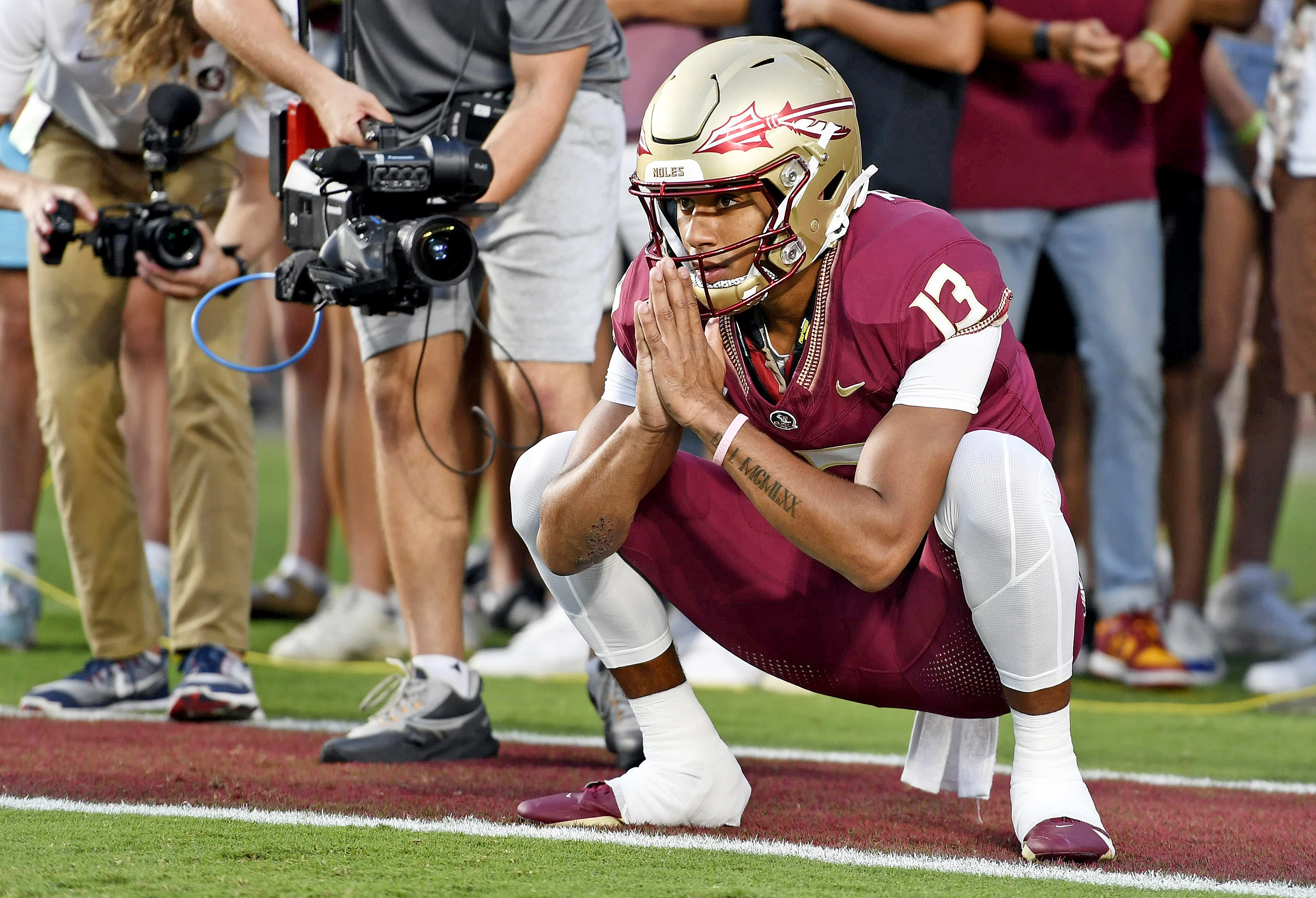 Sep 9, 2023; Tallahassee, Florida, USA; Florida State Seminoles quarterback Jordan Travis (13) warms up before the game against the Southern Miss Golden Eagles at Doak S. Campbell Stadium.