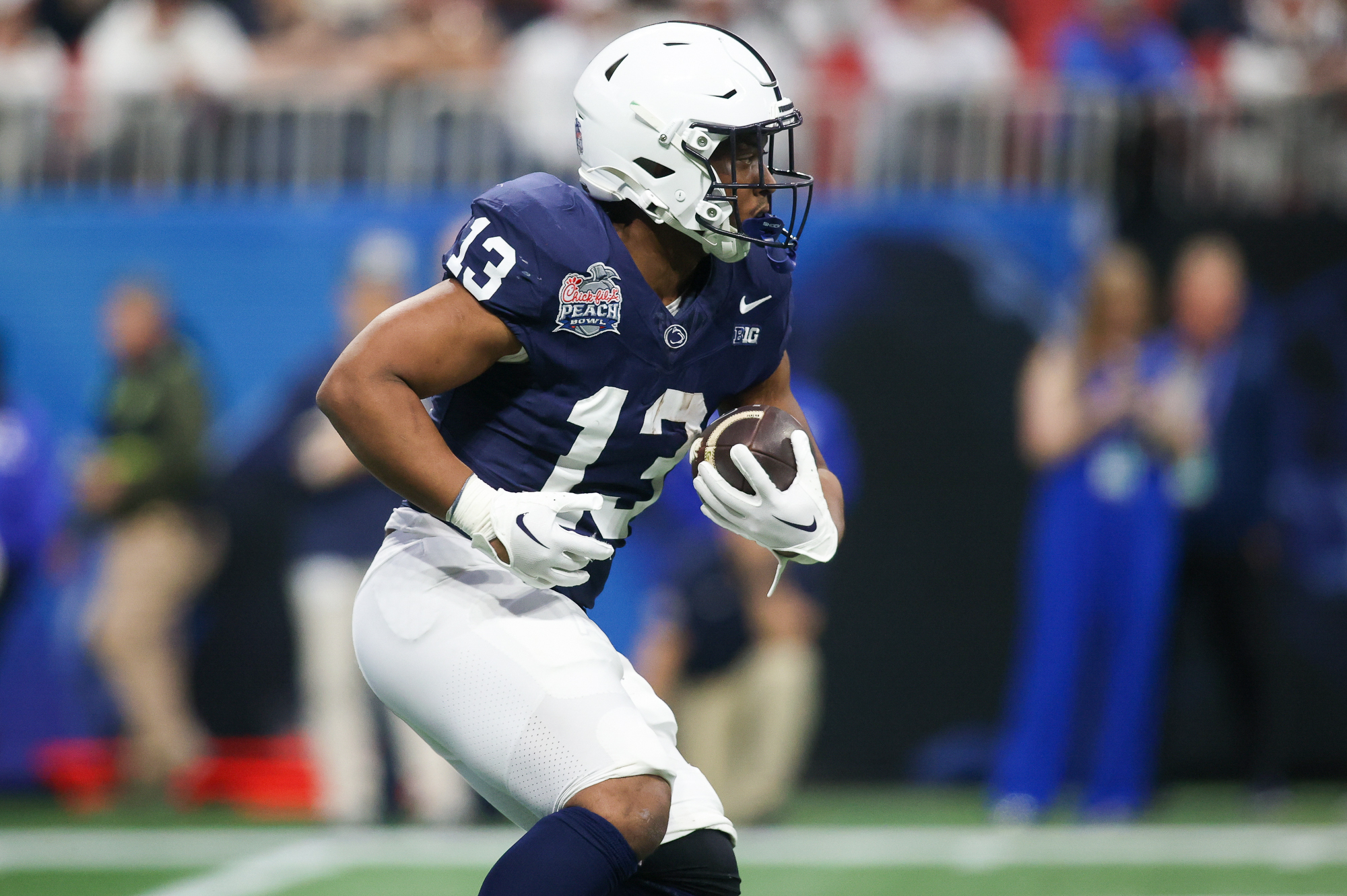 Dec 30, 2023; Atlanta, GA, USA; Penn State Nittany Lions running back Kaytron Allen (13) runs the ball against the Mississippi Rebels in the first quarter at Mercedes-Benz Stadium.