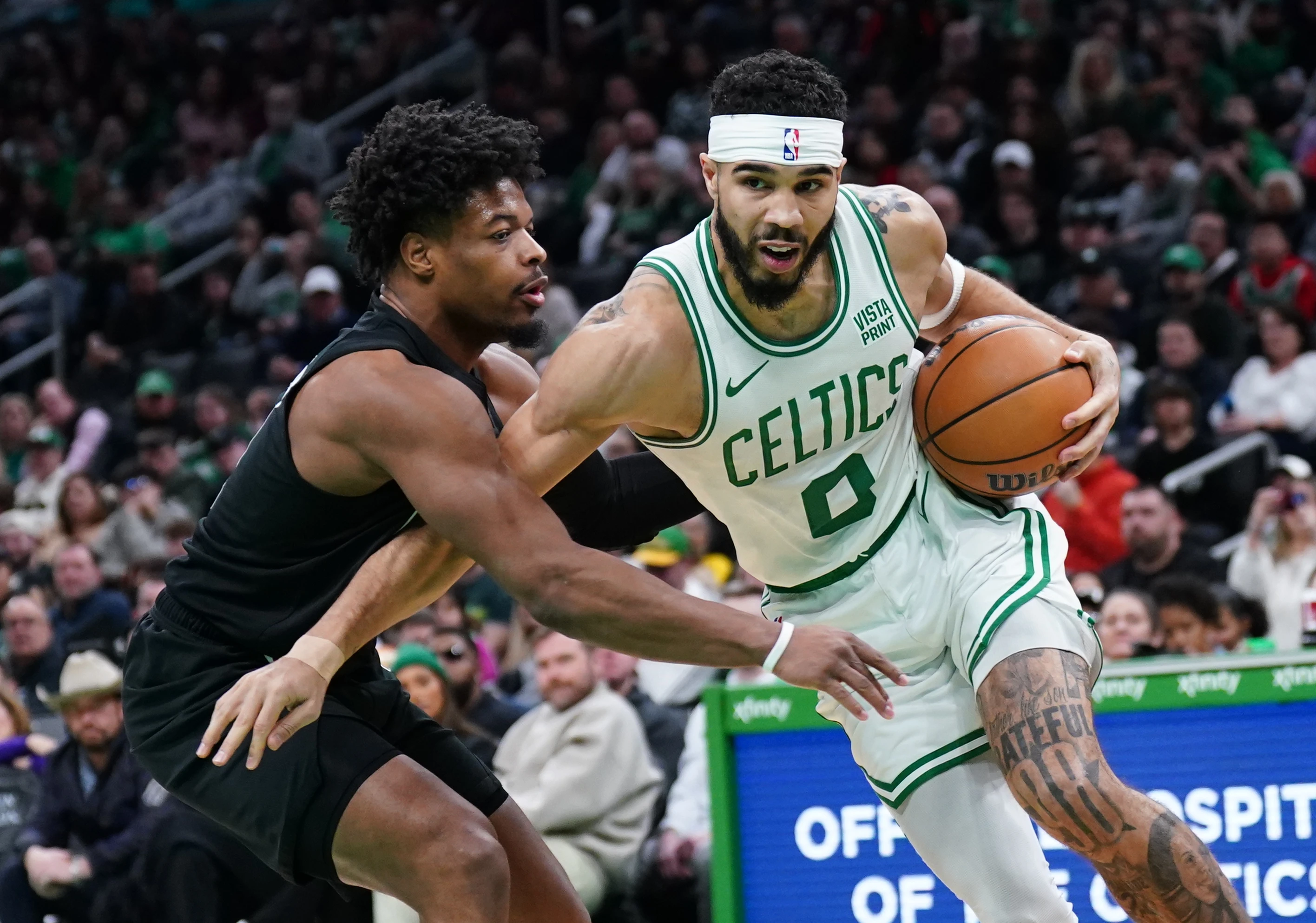 Boston Celtics forward Jayson Tatum (0) drives the ball against Brooklyn Nets guard Dennis Smith Jr. (4) in the first half at TD Garden.